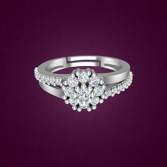 Silver ring with diamond-like stones on a purple background